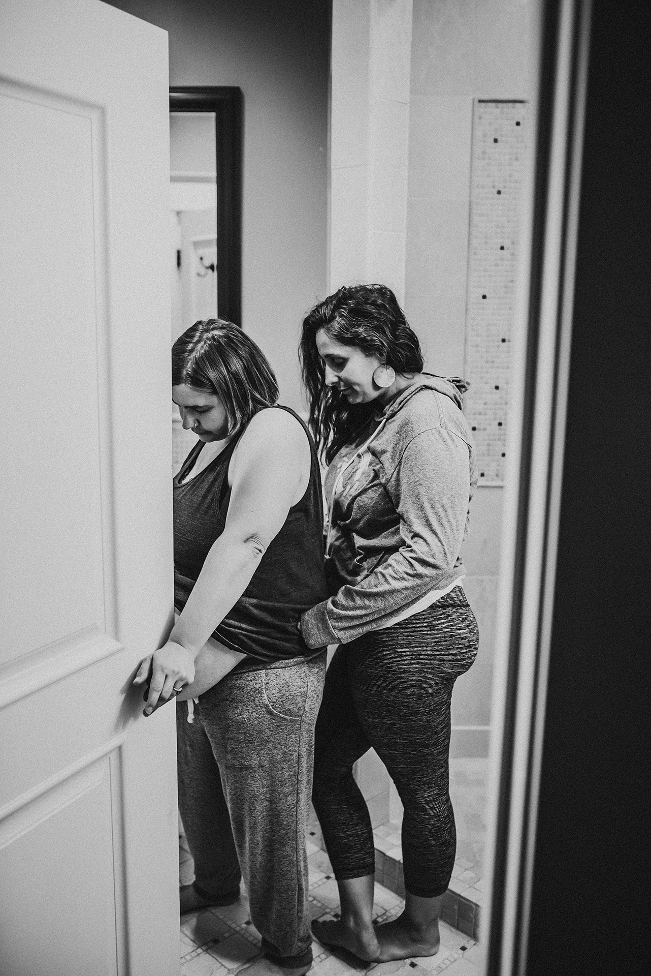 Woman in labor being supported by her doula in Portland Oregon Woman in labor being supported by her doula in Portland Oregon