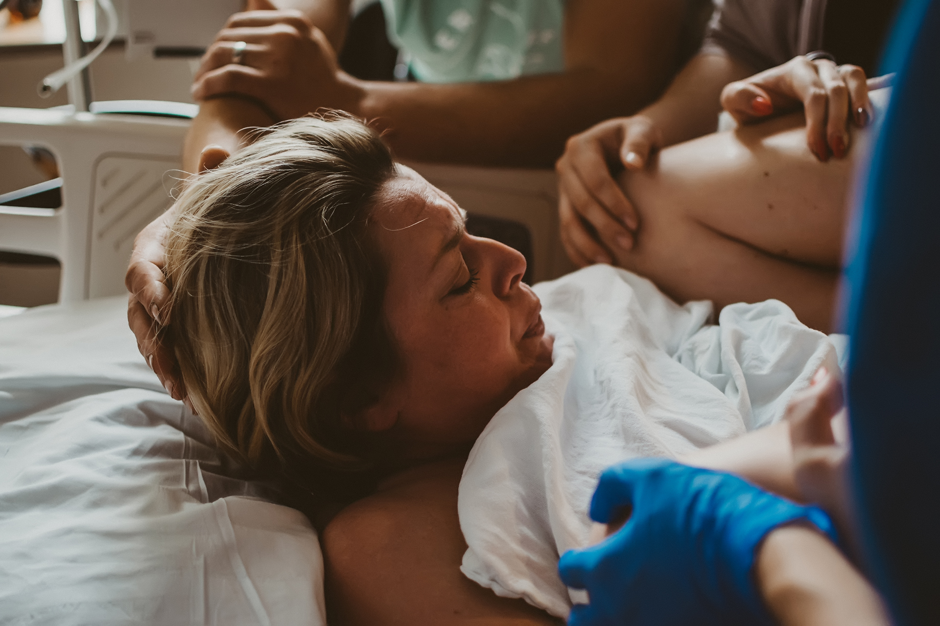 During third stage of labor, she pushes her baby out on her back with her knees bent to her chest During third stage of labor, she pushes her baby out on her back with her knees bent to her chest