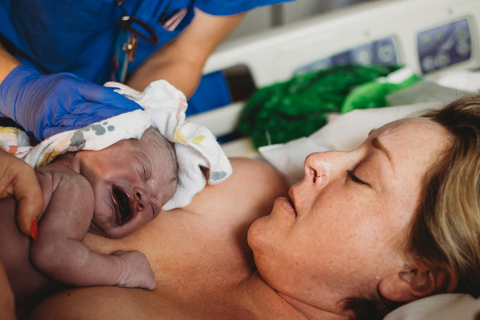 Baby's first cry, newborn still purple from birth Baby's first cry, newborn still purple from birth
